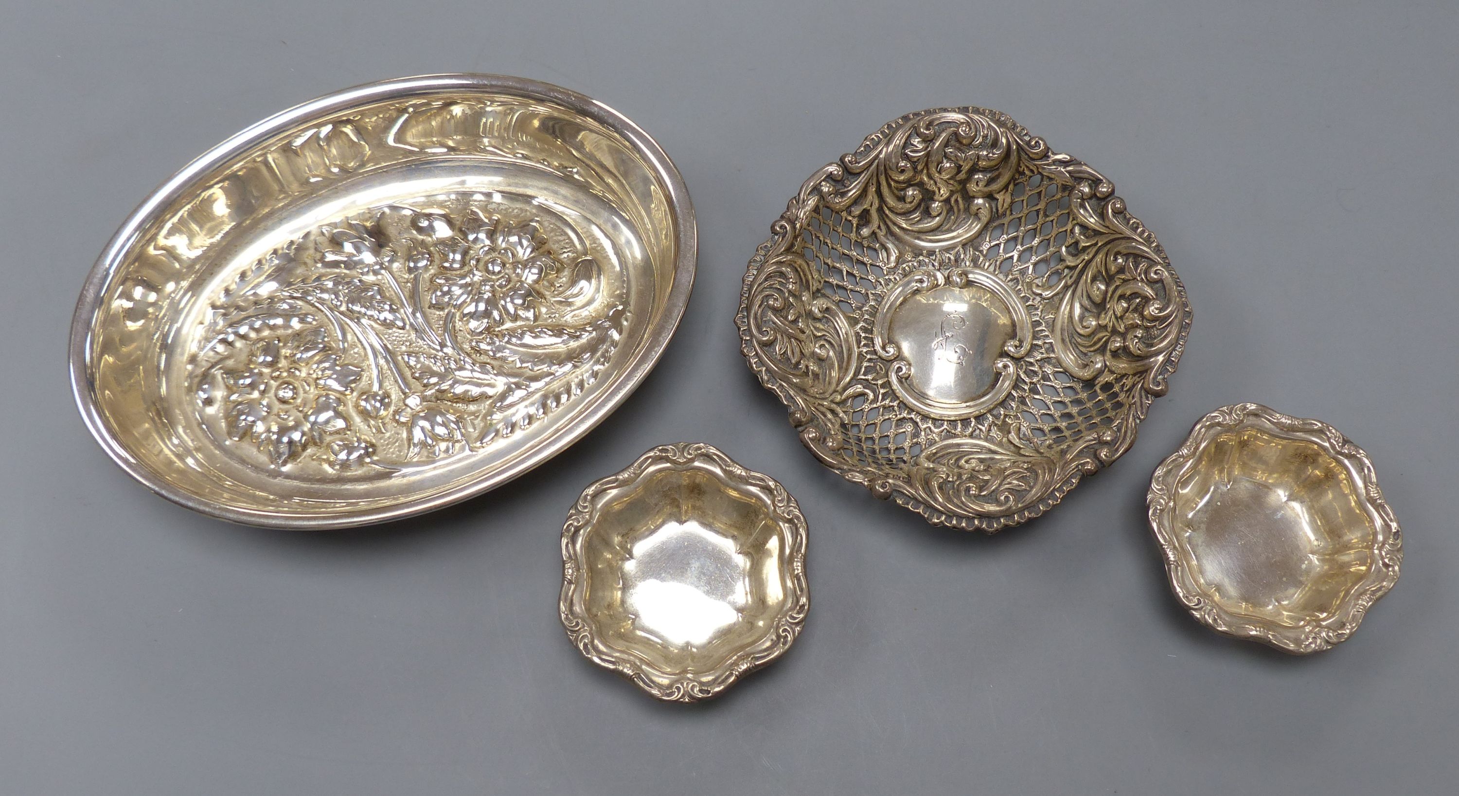 An Italian 8000 standard white metal oval bowl, 15.8cm, two small Birks sterling salts and a repousse silver bonbon dish
